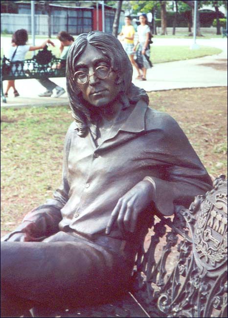 A closeup photo of the John Lennon statue in Havana, Cuba. Complete with Lennon's trademark wire-rimmed glasses, this statue is a remarkably realistic depiction of the former Beatle and internationally acclaimed rock star.