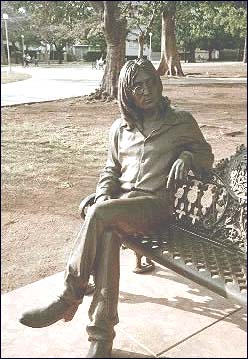 The John Lennon statue in Havana, Cuba. This is probably the most realistic statue that has been erected in the memory of the former Beatle and internationally acclaimed rock musician. People come from all over the world just to sit next to the bronze Lennon who graces the park bench in such a life-like fashion.