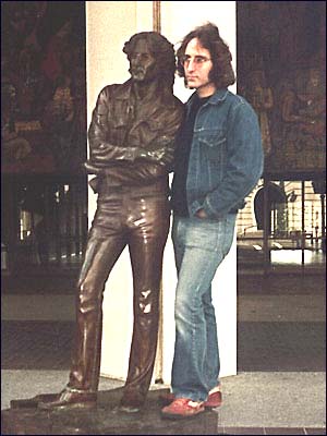 A Lennon lookalike stands with a statue of former Beatle John Lennon in 1981, a year after the rock's stars untimely death..